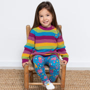 Girl in chunky rainbow pullover